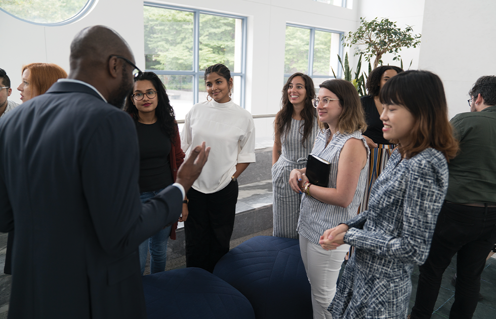 John Jackson speaking with a group of students