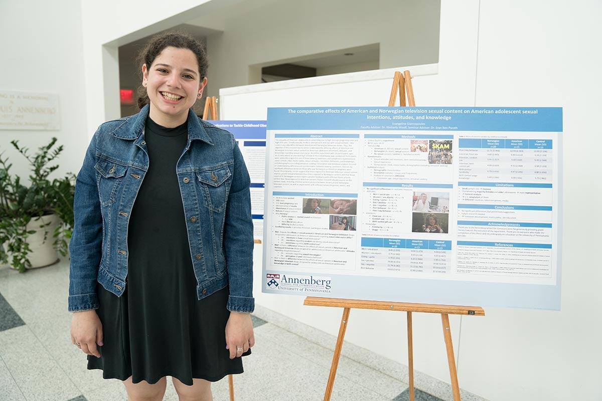 Evangeline Giannopoulos poses with thesis poster.