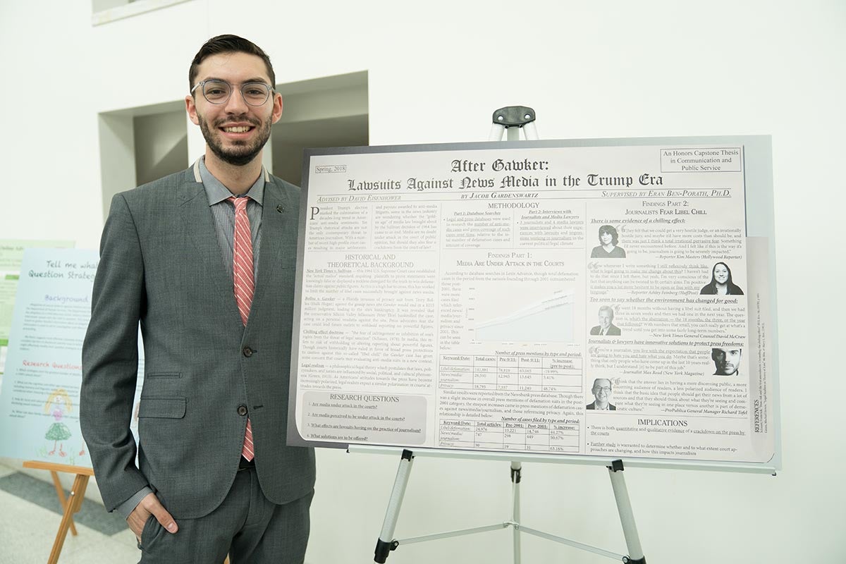 Jacob Gardenswartz poses with thesis poster.