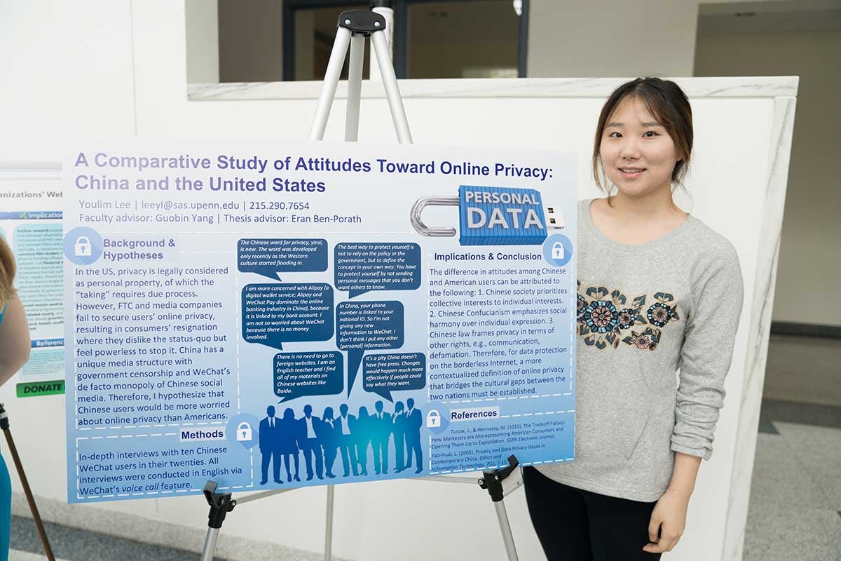 Youlim Lee poses with thesis poster.