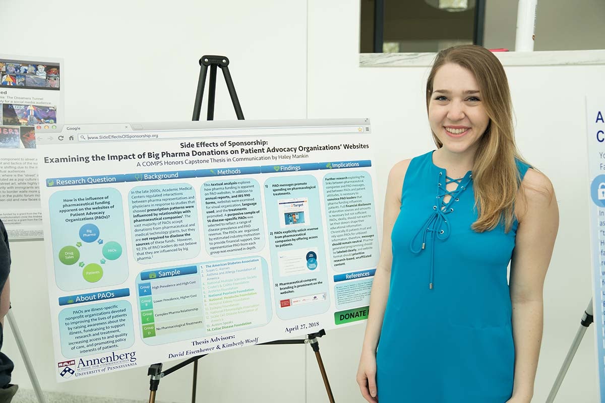 Haley Mankin poses with thesis poster.