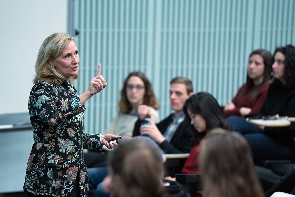 Amy Jordan holds up finger during lecture