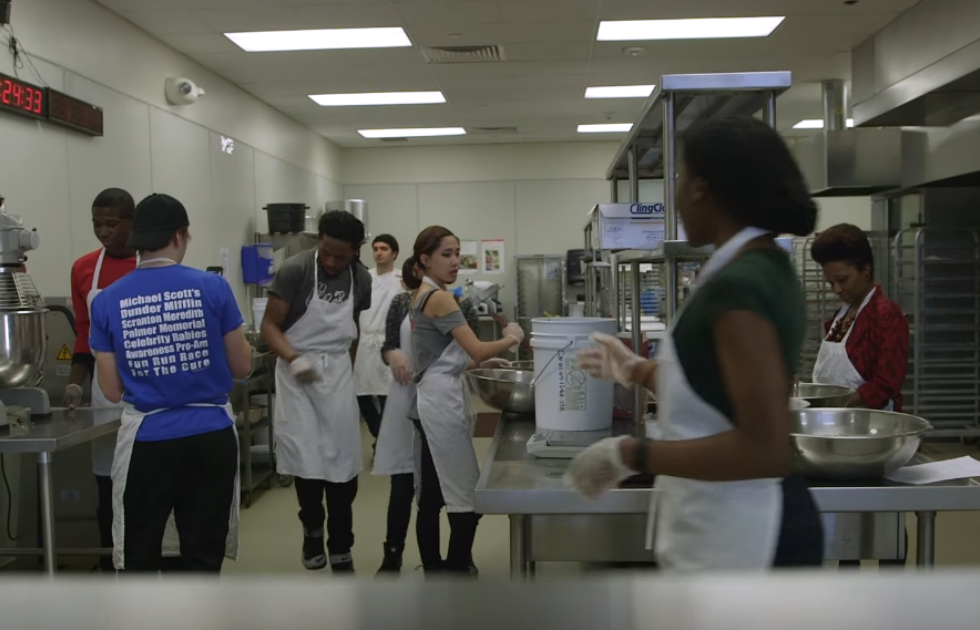 Group of students working in a professional kitchen