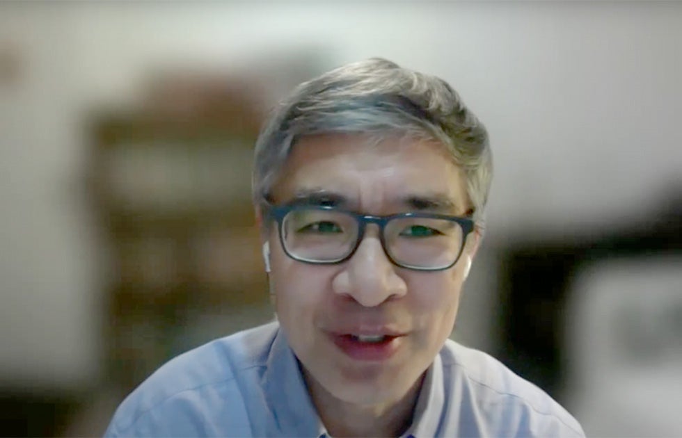 Guobin Yang speaking against a blurred background