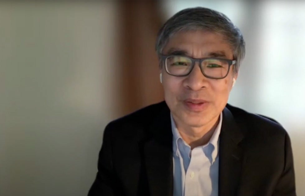 Guobin Yang speaking against a blurred background