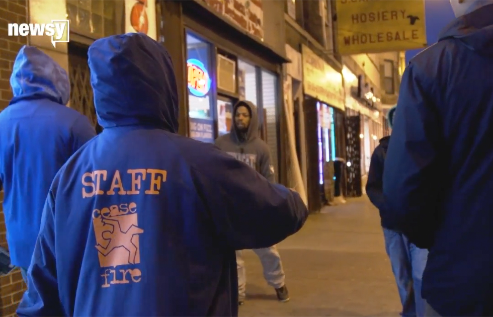 Outreach workers canvassing the streets of a Chicago neighborhood