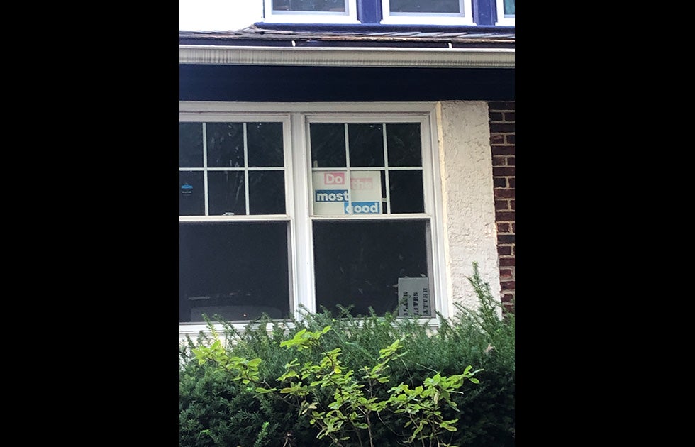 Window with a sign that says “Do the most good” it may or may not be handmade.