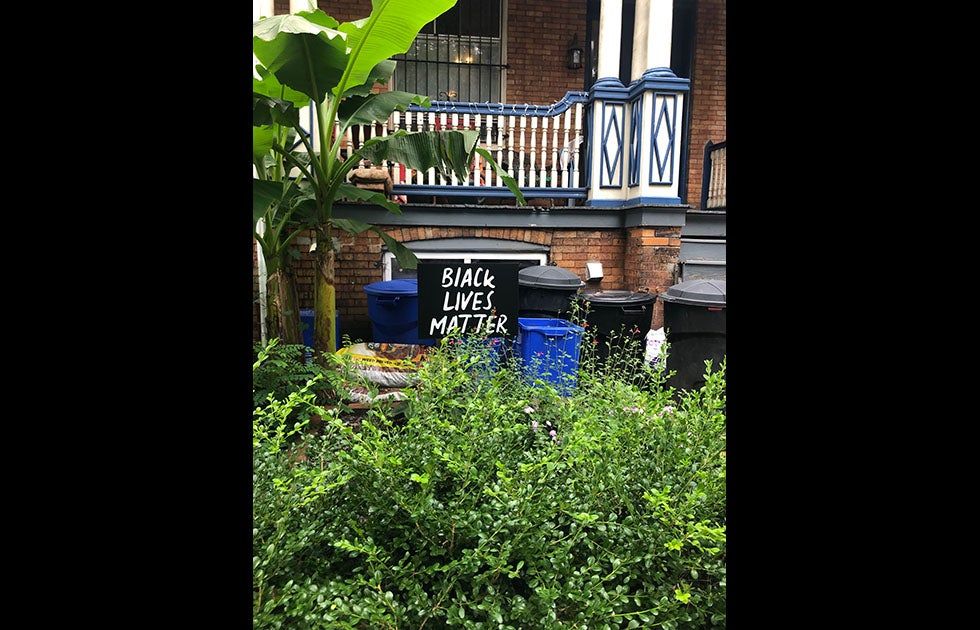 Yard sign that says “Black Lives Matter” and does not appear to be home made.