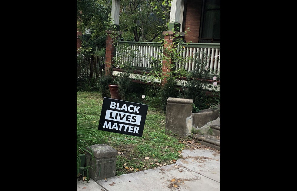 Lawn sign that says “Black Lives Matter” and does not appear to be handmade.