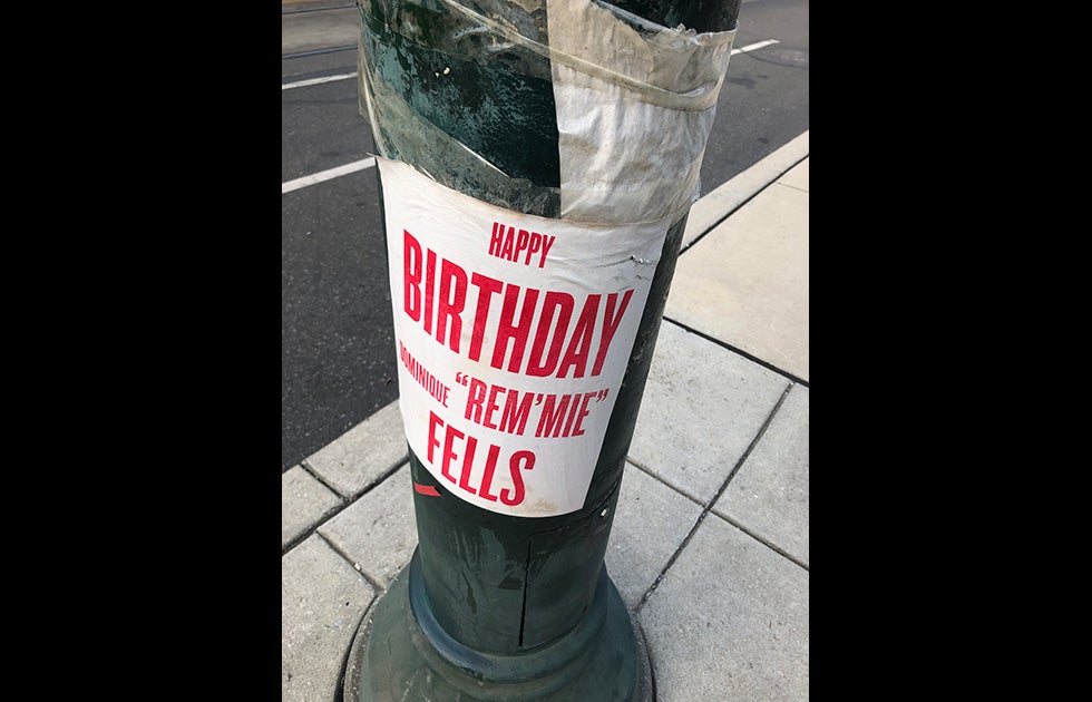 Sign on lamppost that appears to be printed from a computer on regular 8”x11” paper that says “Happy Birthday Dominique ‘Rem’mie’ Fells”.   Note: Rem’mie Fells was one of the two transgender women killed in Philadelphia in 2020.
