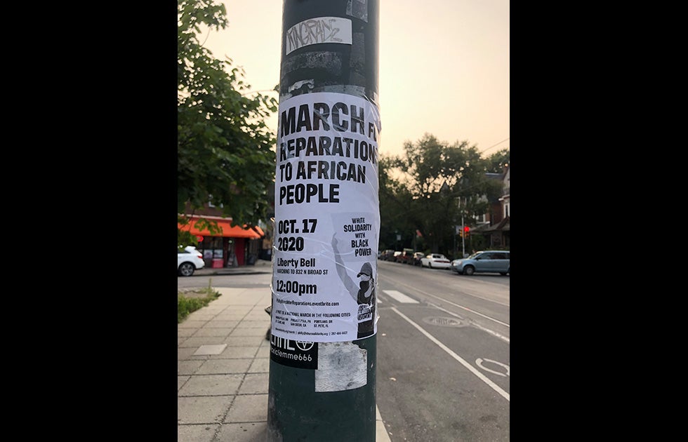 Flyer that says “March for reparations to African people. Oct. 17 2020 Liberty Bell Marching to 832 N Broad St. 12 pm” there is also a URL, a list of other march locations across the country, an email address, and a phone number. There is also an image of a white person holding a sign that says “White Solidarity with Black Power”