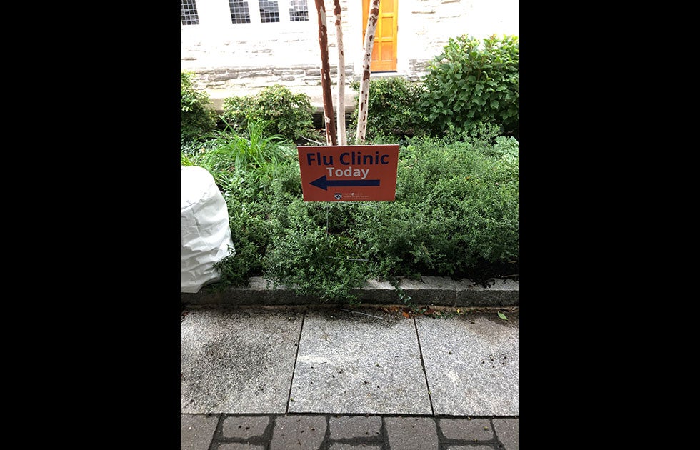 Sign that says “Flu Clinic Today” with University of Pennsylvania logo.