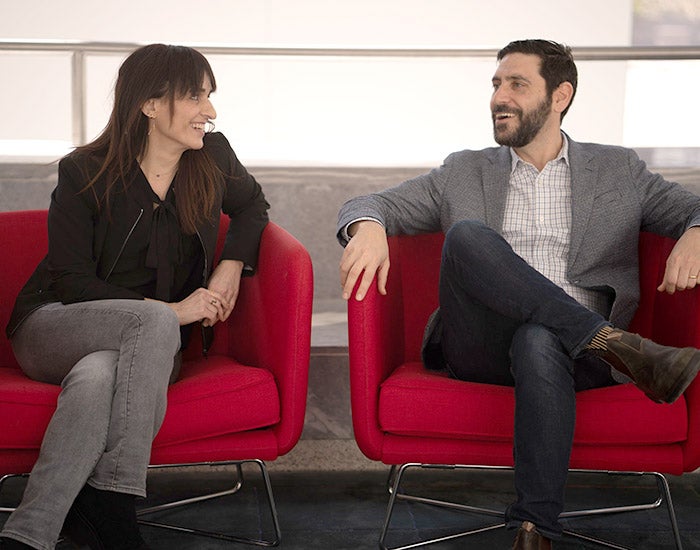 Sandra and Yph.jpg Sandra and Yph seated in red chairs talking to one another