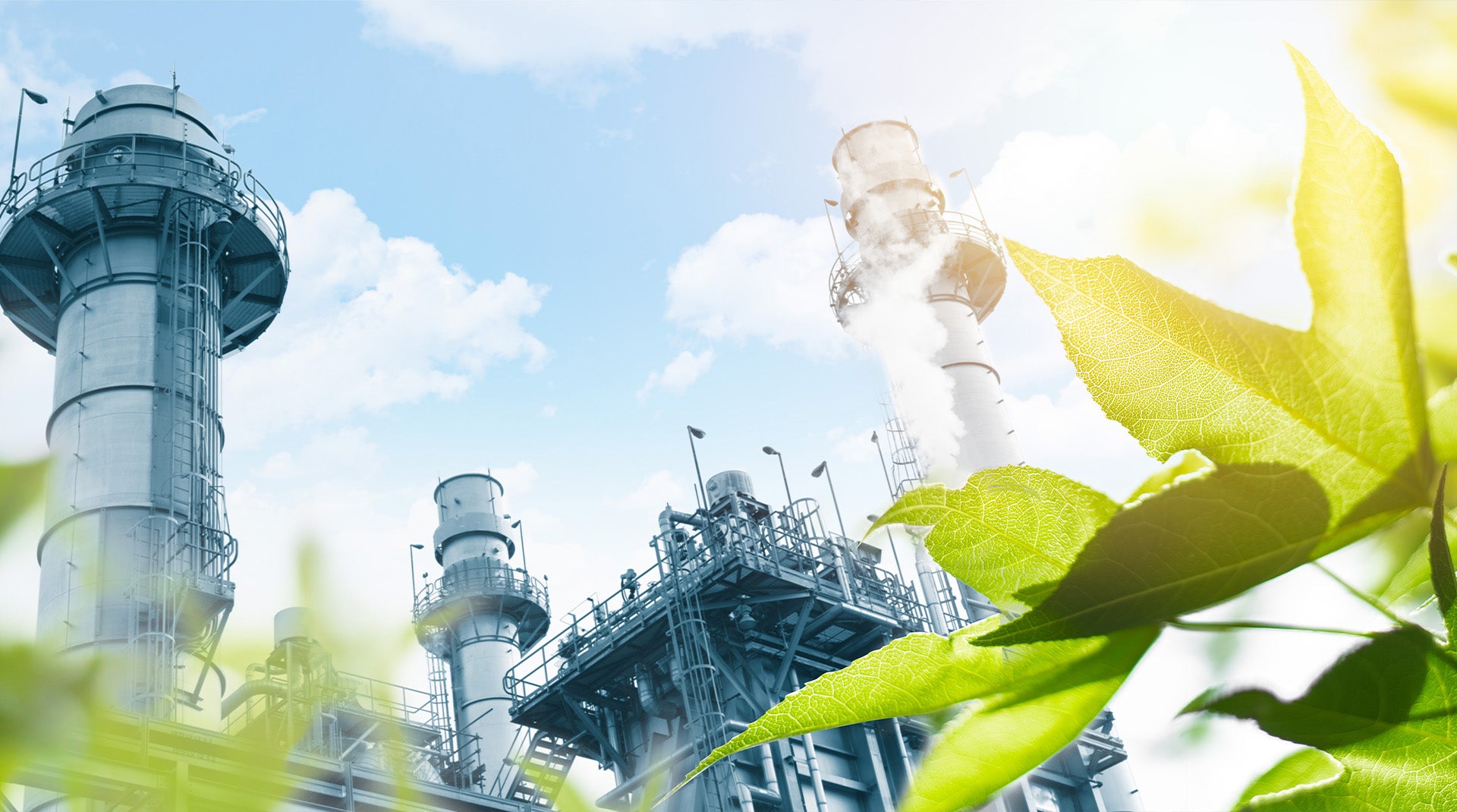 Power plant towering over green vegetation
