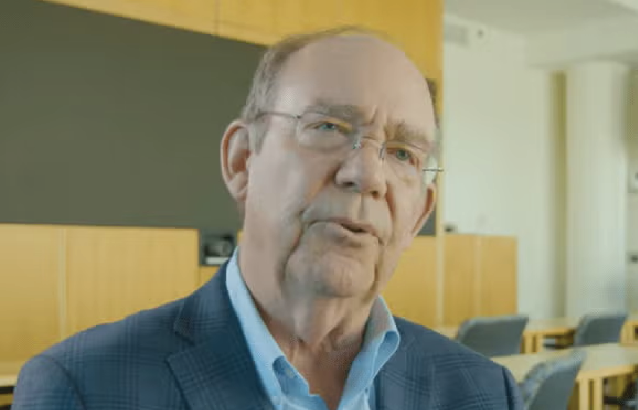David Eisenhower_Gallery David Eisenhower seated at a table in a classroom.