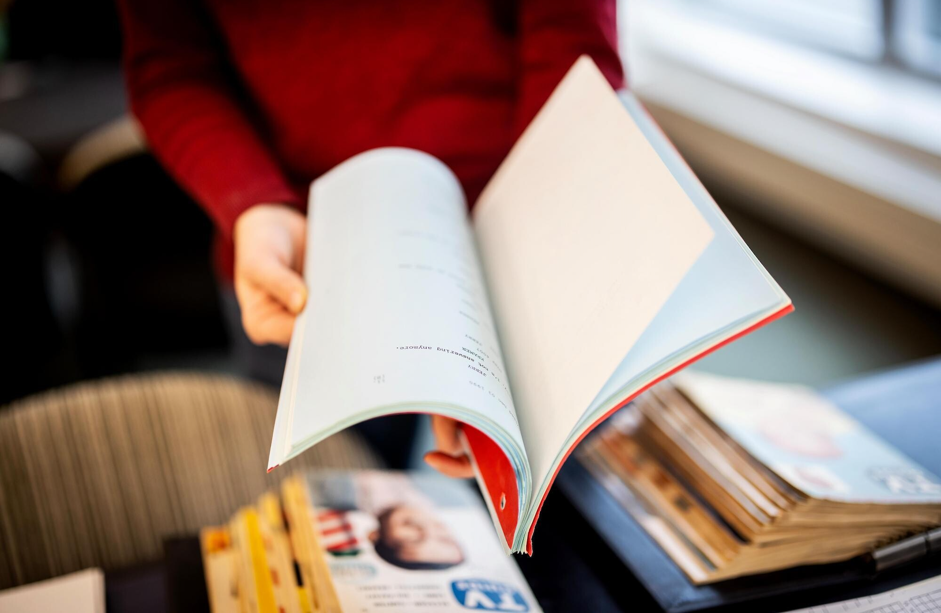 A person holds a copy of a Seinfeld script