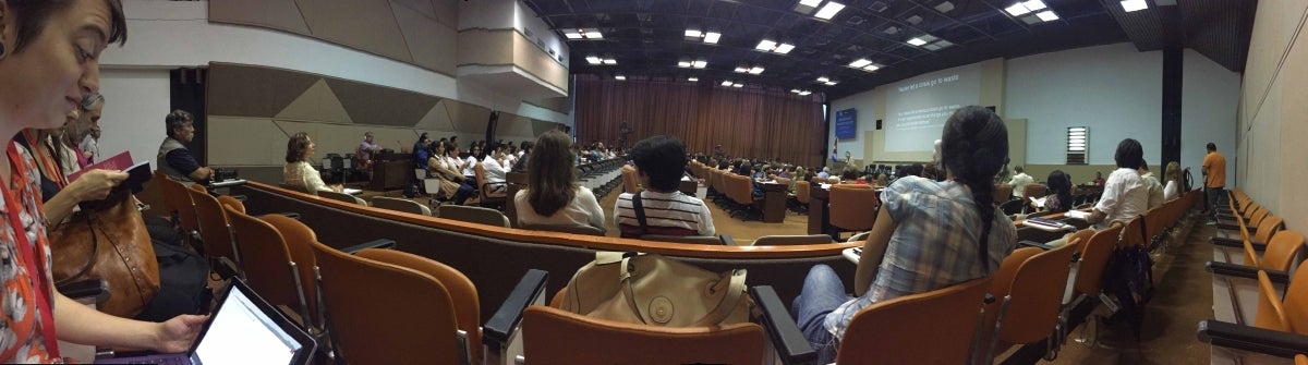 Panorama of attendees listening to a conference