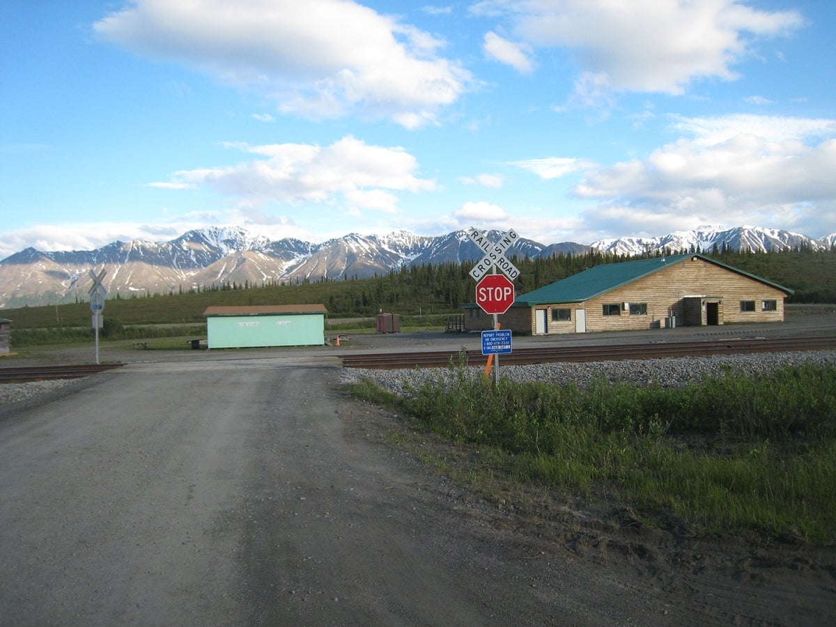 View of empty intersection and stop sign in Alaskan landscape