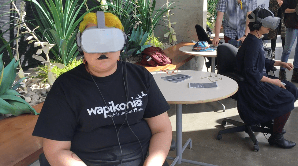 Woman in black lipstick wearing a VR headset