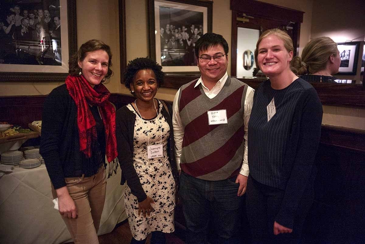 Jazmyne Sutton poses with other doctoral students and a research director for photo