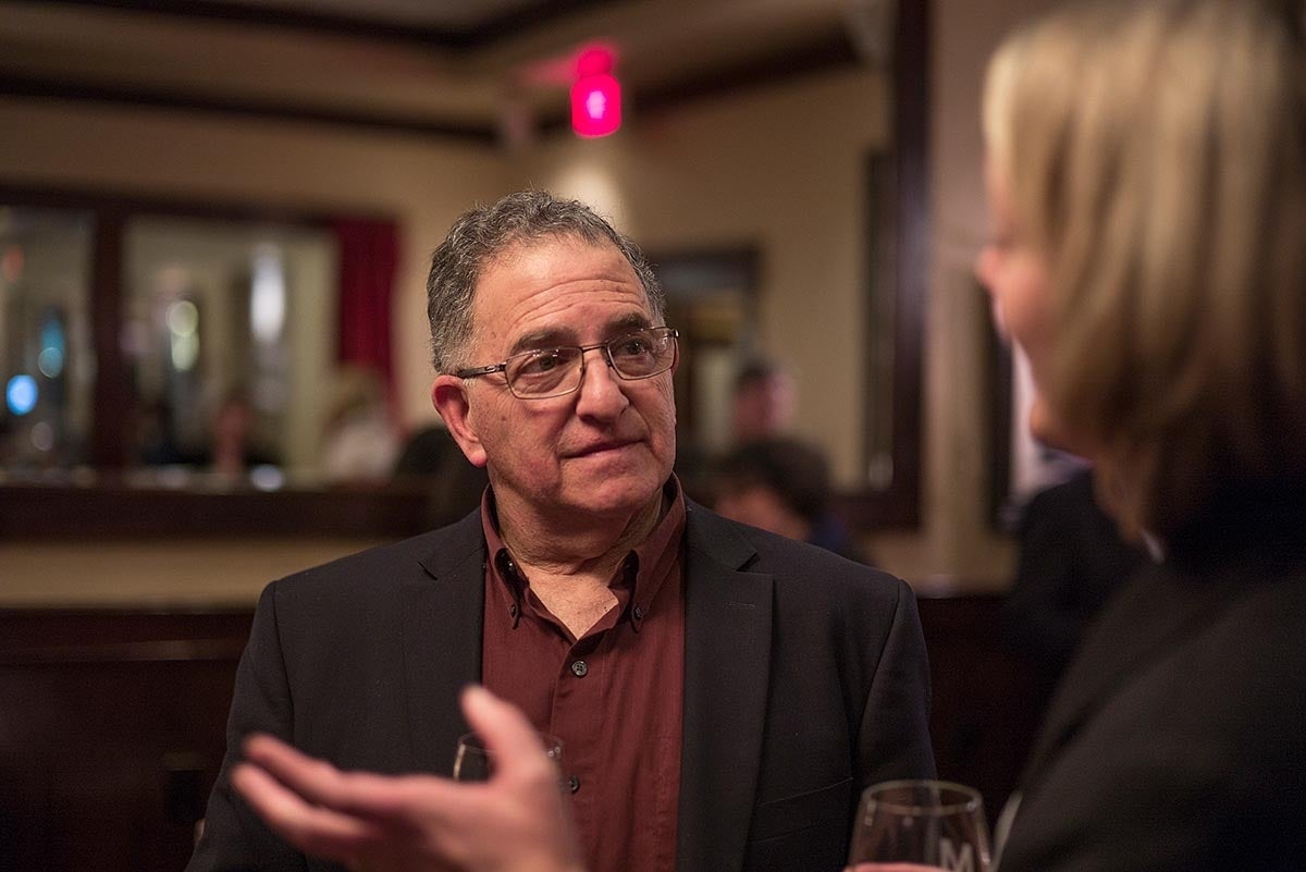 Joseph N. Cappella engaged in conversation with someone