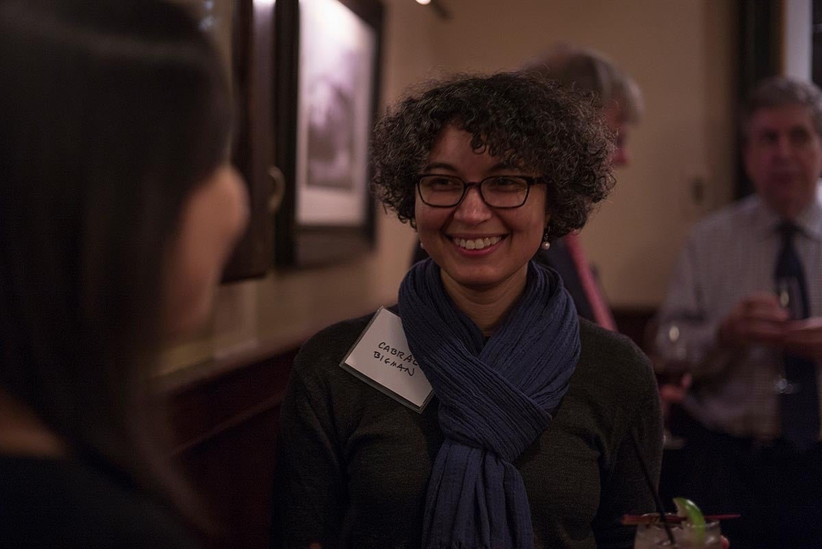 Cabral Bigman-Galimore smiling while engaged in conversation with someone