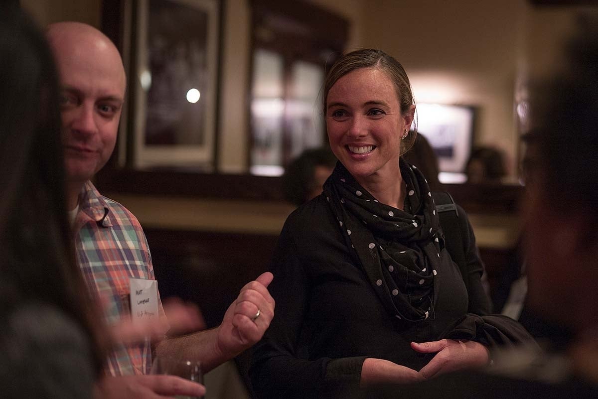 Matt Lapierre and Erin Maloney having a conversation with two others outside of the frame. 