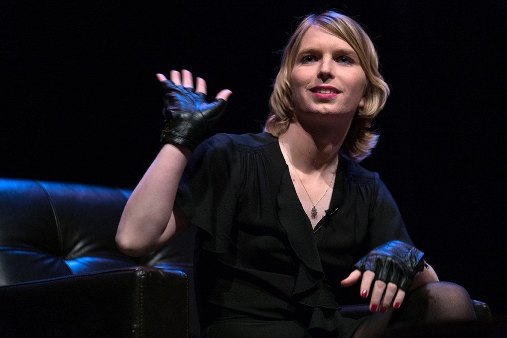 Chelsea Manning waving at audience