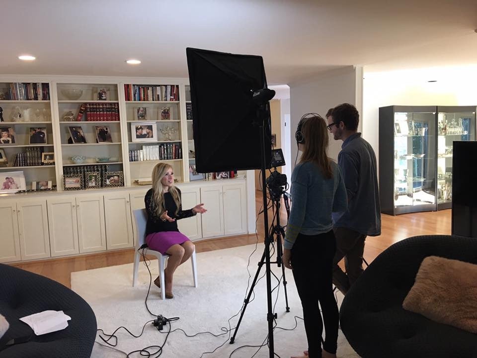 Tyler Burke and Amanda Prager film an interview with matchmaker Lori Salkin