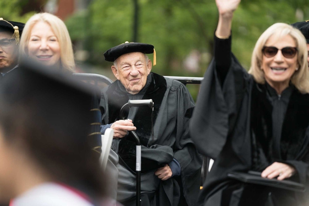 Elihu Katz in doctoral regalia seated. To his right is Penn President Amy Gutmann and to his left is Andrea Mitchell