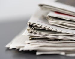 MIC BLM Project checkerboard 700x550 Mike van Schoonderwalt from Pexels.jpg Stack of folded newspapers, no text visible, Photo credit: Mike van Schoonderwalt from Pexels