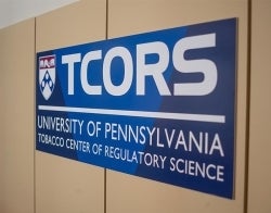 TCORS sign 700 x 550.jpg TCORS logo sign hanging on the wall reading "TCORS. University of Pennsylvania Tobacco Center of Regulatory Science"