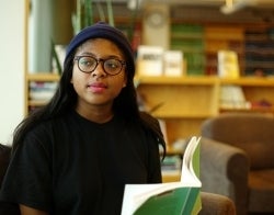 Student in Library 700 x 550.jpg Student sitting in the Annenberg library with a book open in her lap