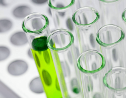 ScienceCommunicationBillOxfordUnsplash.png Viles in a lab, one filled with a green liquid. Bill Oxford / Unsplash