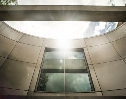 Building and Sun 700 x 550.jpg Decorative abstract angle of Annenberg Building architecture with the sun shining in the sky