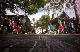 walking down Locust Walk 1920x1250.png low angle view of students walking down Locust Walk on a bright day