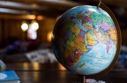 globe sitting on a table, photo credit Kyle Glenn / Unsplash