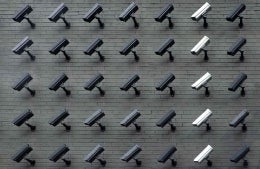 Surveillance cameras arranged in a 5x7 array, photo credit Lianhao Qu / Unsplash