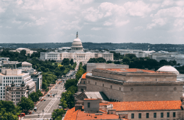 Aerial view of Washington D.C. on a bright day with the United States Capitol in the distance, photo credit Vlad Tchompalov / Unsplash