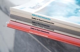 Photo of a stack of "Studies in Visual Communication" books