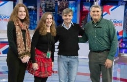 Four Annenberg alumni posing in front of ABC news studio