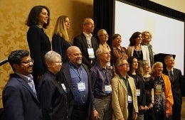 Inductees to the international communication association posing for photo