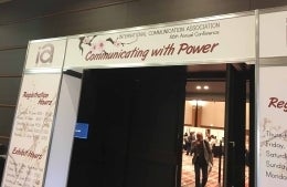Doorway entrance that reads Communicating with Power