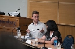 Tyler Leigh moderating a panel discussion