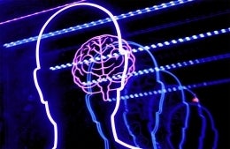 Neon purple outline of a human head and a human brain, with the outline of the head being repeated. The repetitions become bluer and blurrier; photo credit: Bret Kavanaugh / Unsplash