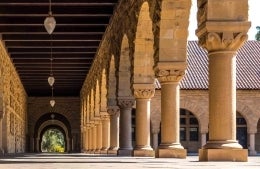 exterior hallway on Stanford University's campus, photo credit Jason Leung / Unsplash 
