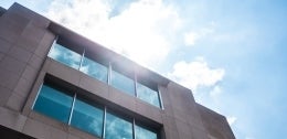 Walnut facing side of the Annenberg building with blue skies in the background