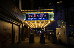 The late show with Stephen Colbert sign lit up outside, photo credit iStock / Joel Carillet 