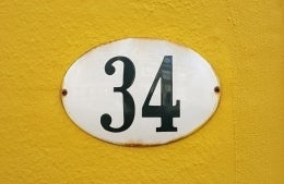 the number 34 on a yellow background; Photo Credit: Marianne Bos on Unsplash