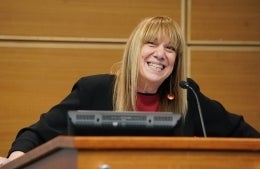 Barbie Zelizer speaking at a podium